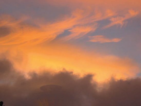 These clouds were fleetingly lit by the setting sun.