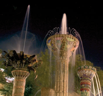 Shoot fountains lit at night.