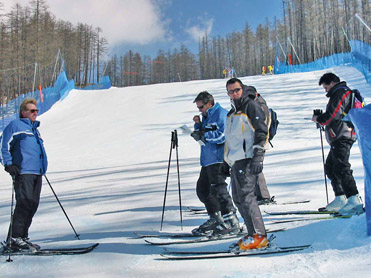 Figure 6.2 Site surveys may include putting on skis and skiing the course. Here, a producer and director survey a mountain venue to determine the best camera positions