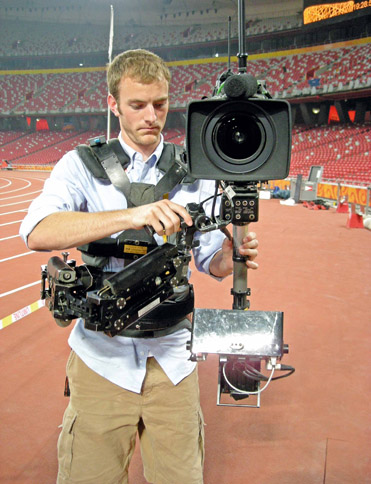 Figure 7.17 The Steadicam uses a vest and stabilizing arm to create smooth shots when moving.