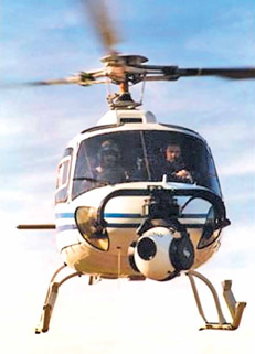 Figure 7.24 Helicopter equipped with a stabilizer remote-controlled camera.