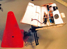 Figure 7.26 The first photo shows the inside of the cone camera, which includes a camera, battery, and transmitter. The second photo shows the camera placed on the ice. The third photo shows the shot obtained by the camera.