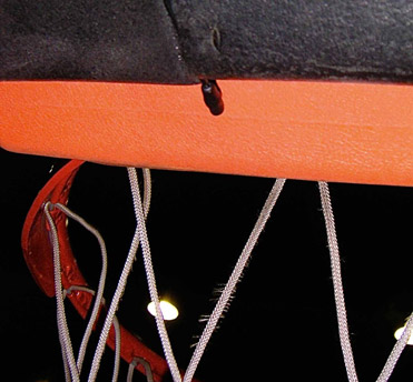 Figure 9.7 Lavaliere microphones. The second photo shows a lavaliere microphone attached to a basketball backboard to pick up the sound of the ball hitting the board, hoop, and net.