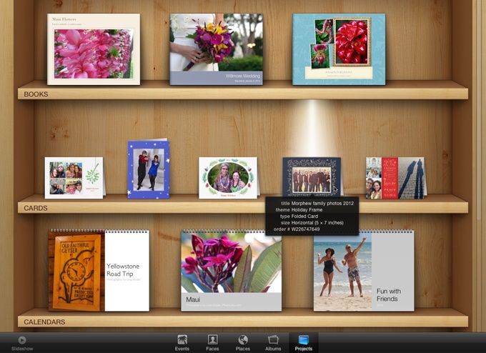 Once you’ve gotten a book, calendar, or card under your belt, Full Screen view reveals the world’s coolest project bookshelf.Click a project to see iPhoto illuminate it with a built-in shelf light. Point your cursor at a project to see its details.