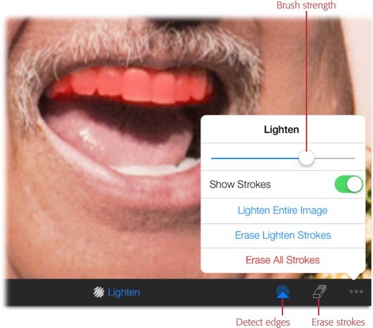 You can use the Lighten brush to whiten your subject’s teeth. Tap the Options icon and then turn on Show Strokes to see a red overlay where you’ve painted (visible here). Turn on Detect Edges and iPhoto tries to confine your strokes to areas of similar color and brightness (more on this setting on page 355).When you’re finished painting, turn off Show Strokes so you can see your handiwork, and then use the strength slider labeled here to fine-tune the opacity of your edits (drag left to reduce their strength, or drag right to increase it).