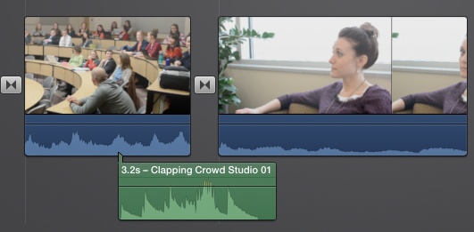 A connected audio clip looks a lot like a background music clip, but it has a green flag that shows you when the audio kicks in. If you drag the video clip to another part of your project, the connected audio clip comes with it.