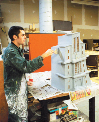 Cole Campbell paints a set piece for Twisteeria, 1998. (Courtesy of Bowes Productions Inc.)