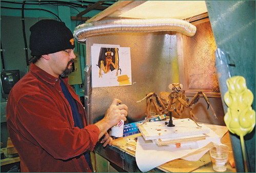 Puppet supervisor Rob Ronning paints a puppet for MTV/Insight Films’ Monster Island, 2004. (Courtesy of Bowes Productions Inc.)