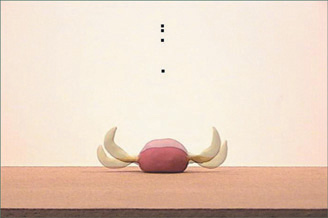 The ball starts to transition into its stretched shape before it bounces back up, and the pigtails fall to catch up with the landing.