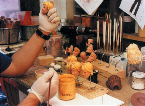 Painting duplicate puppet heads. (Courtesy of Zung Studio.)
