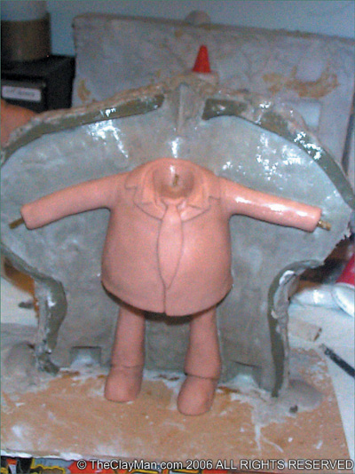 The first half of the mold with the sculpt embedded inside. (Courtesy of The Clayman’s 3D Cartoon Communications.)