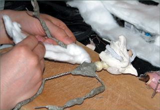 Strips of cotton are wrapped around the armature.