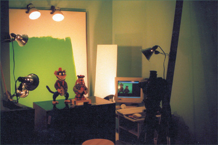 A simple setup for puppets in front of a green screen.