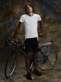 Being open to spontaneity can help capture impromptu portraits. My wife’s nephew had just arrived after a four-day bicycle ride from Ohio to New Jersey. Before he cleaned up, I placed him in front of a background with his bike, positioned some lights, and shot this portrait. Copyright © Steve Weinrebe, Getty Images