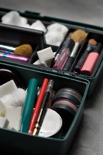 A fishing tackle box has loads of room for cosmetics, brushes, and other makeup items. This one cost well under $10, and its dark, muted colors make it fit in as a piece of photo gear. Copyright © Steve Weinrebe