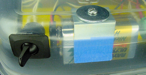 Rear-mounted power switch (left) and battery (right)