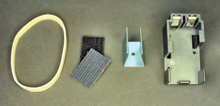 Methods of mounting a 9 V battery: (left to right) rubber band, hook and loop fasteners, clip, molded part