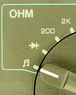 Multimeter dial set to continuity