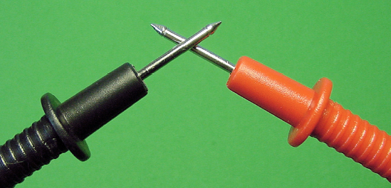 Touching the probe tips together to make an electrical connection