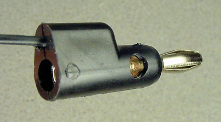 Banana plug with a jack in the middle and the rear