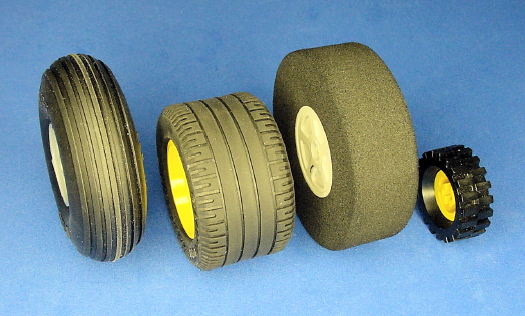 Left to right: Sealed pneumatic, semi-pneumatic, foam, and solid tires