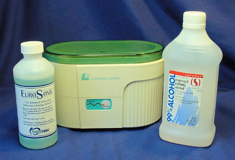 Ultrasonic cleaner (middle) with cleaning solution (left) and 99% isopropyl alcohol (right)