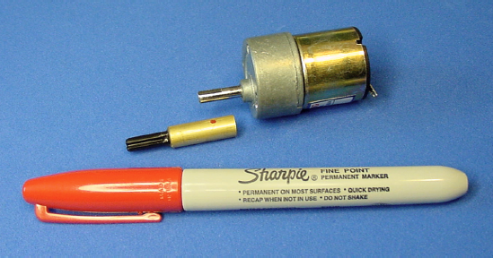 Marking desired location for the setscrew hole on a coupler using a fine-point permanent marker
