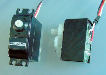 Servo (left) and exposed servo showing gears and circuit board (right)
