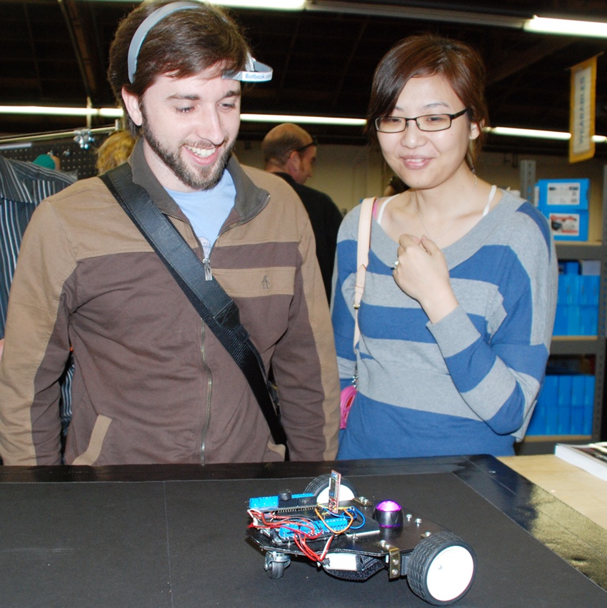 Attendees control our robot at Maker Faire.