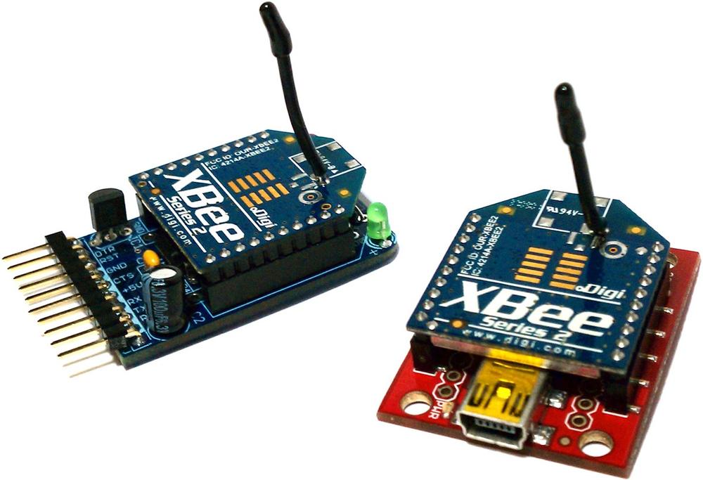 Two XBees, one connected to an Adafruit adapter and the other connected to a SparkFun adapter