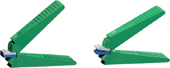 Two brick separators working to take apart two 2×2 plates. Gently squeezing the two handles is usually enough to quickly separate even the most stubborn pieces.
