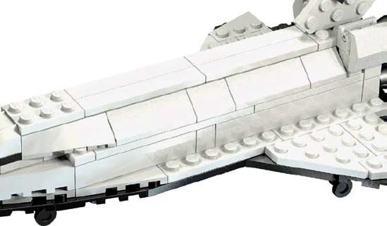 On this small model, we repeat only a few tiles and slopes to make the cargo bay doors. On a larger-scale version of the shuttle, you would probably use much more repetition.