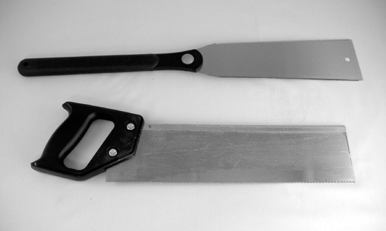 A conventional crosscut saw (bottom) and a ryoba (top)