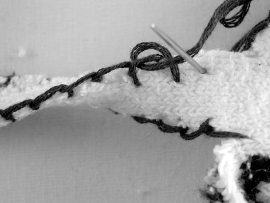 A close-up of the blanket-stitched arm