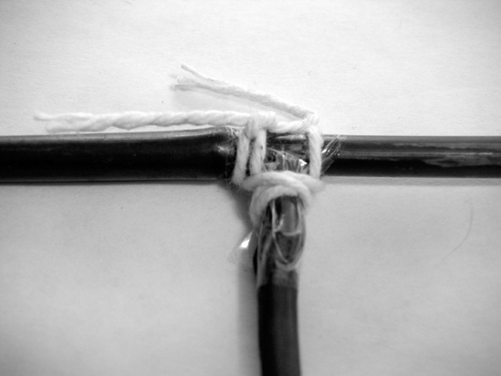 Wrap the cross braces’ joints with string.