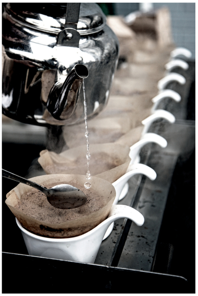 FIGURE 29 Pouring water interrupts the visual rhythm of the coffee cups, creating a more intense image.