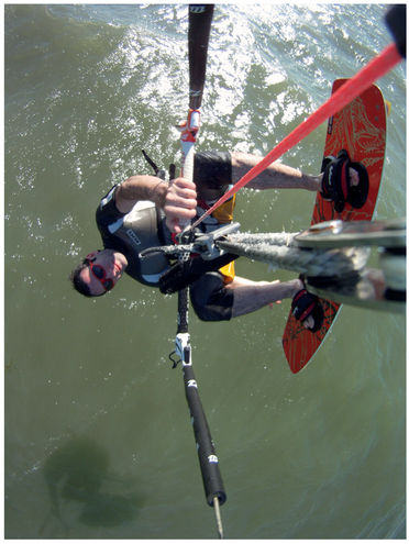 FIGURE 6 By attaching a small GoPro camera to his kite lines, Josh was able to bring the viewer right into the action while kiteboarding. The shadows and angles relative to the water give clues as to where he is and in what position, and this image most likely makes you go “whoa” more than you would when viewing an image of someone sitting on a bench.