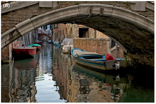 FIGURE 15 The initial shot (A) is too visually intense, so we chose a longer focal length to remove the distracting elements. Shot (B) has a more visually pleasing level of energy and guides the viewer’s eye along the canal.