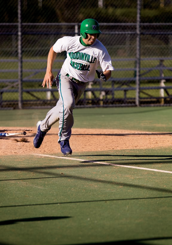 In this image, I wanted to capture the motion of the bat hitting the ground as well as the batter heading for first base.