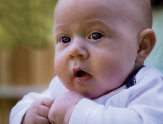 For this portrait, I placed this 3-month-old baby in open shade to prevent him from squinting in brighter light. Exposure: ISO 200, f/4, 1/500 second.