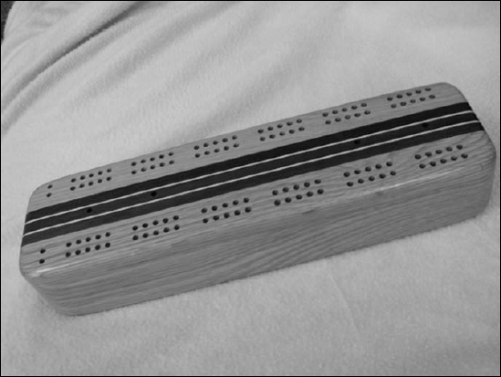 A traditional cribbage board.