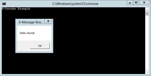 A screenshot of the console window showing how P/Invoke allows you to execute unmanaged API calls from managed code. A standard message box appears in the middle of the screen with the words “Hello World” as the caption, a title, and an OK button.