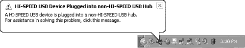 A warning triggered by plugging a Hi-Speed USB (USB 2.0) network adapter or other device into a USB 1.1 port on a system running Windows XP.