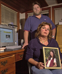 Amy Boyer’s parents holding her photo