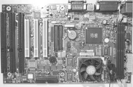 System board with coin-style battery used to retain CMOS memory