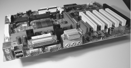 This newer ATX-style system board includes all of the basic I/O you’ll need: PS/2 ports, USB, COM, LPT, game port, and sound