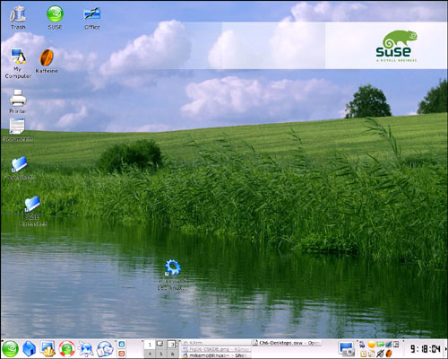 The SUSE default KDE desktop. Along the bottom are the standard application icons, virtual desktops, and applications that run at startup.