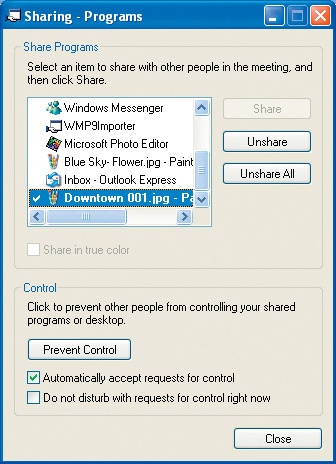Select the programs and documents to share using the Sharing dialog box.