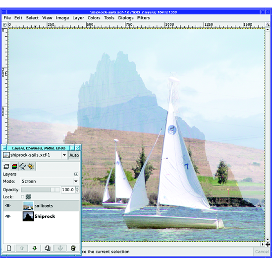 Sailboats in front, in Screen mode; Shiprock in back