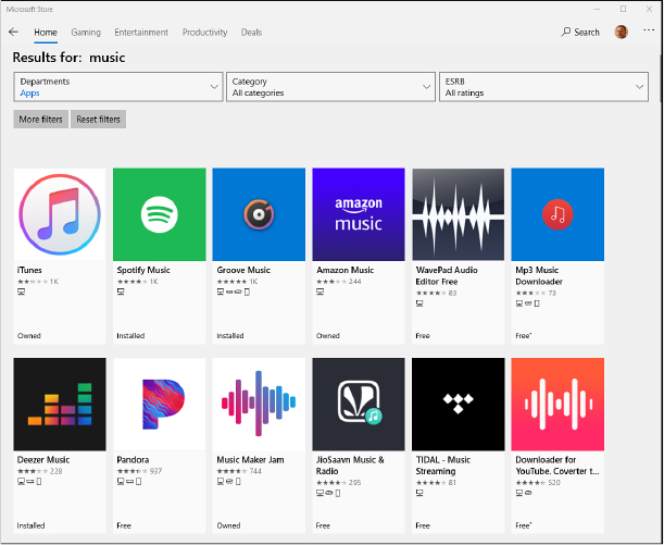 This screenshot shows the Microsoft Store app, with search results for the term “music” and icons for 12 apps, including iTunes and Spotify Music, in the main window.